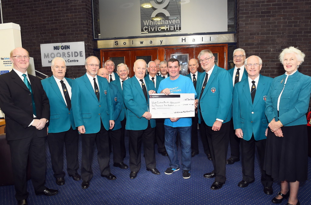 In January the choir presented a cheque for £2600 to John Kane of the west Cumbria branch of Parkinson's UK. The money was from proceeds of the choir's Chrismas concert and carol singing in local supermarkets.